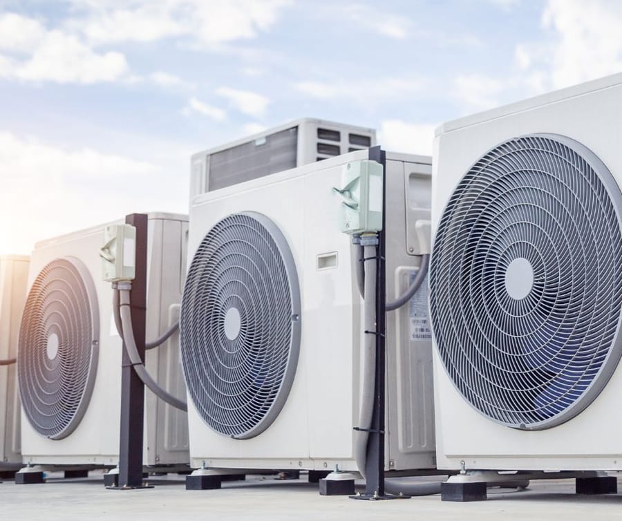 HVAC units lined up beneath a clear sky